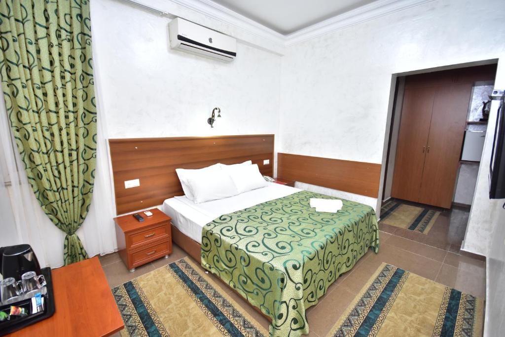 Postel nebo postele na pokoji v ubytování Hotel Chao