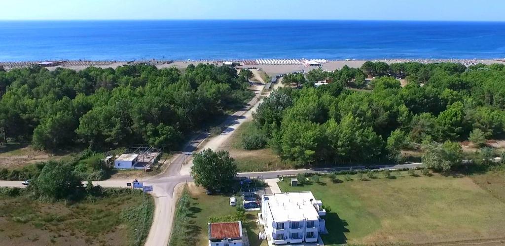 an aerial view of a house and the ocean at Riviera Inn apartments in Ulcinj