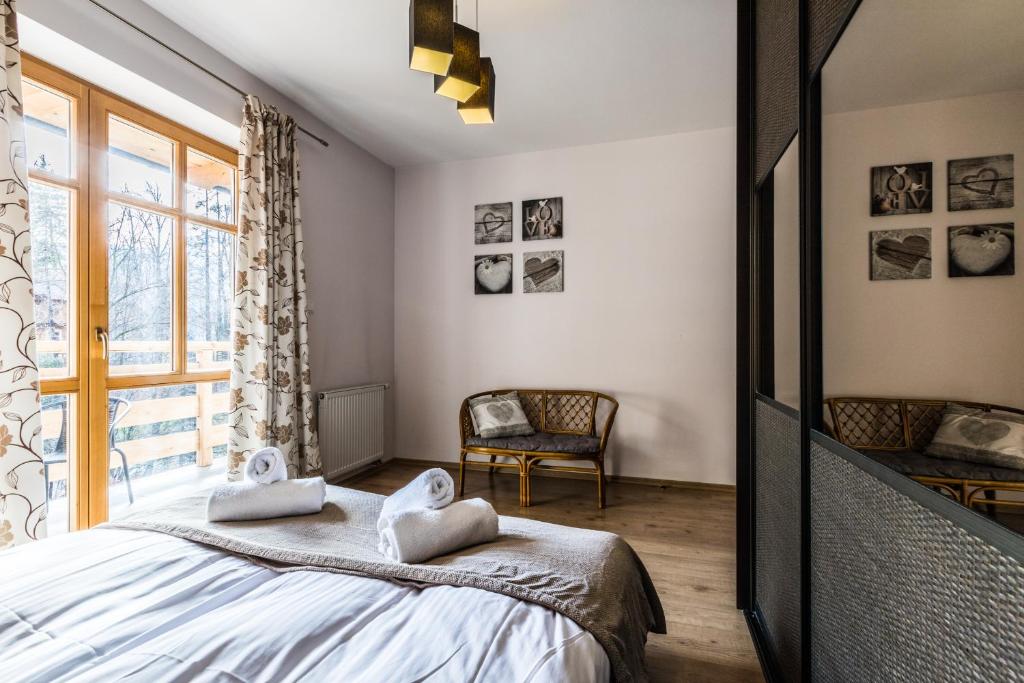 Posteľ alebo postele v izbe v ubytovaní Apartament Górski Deluxe Odkryj Zakopane