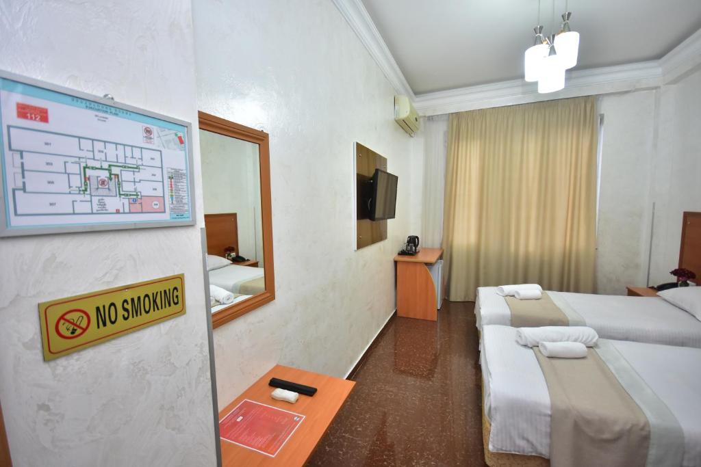 Postel nebo postele na pokoji v ubytování Hotel Chao