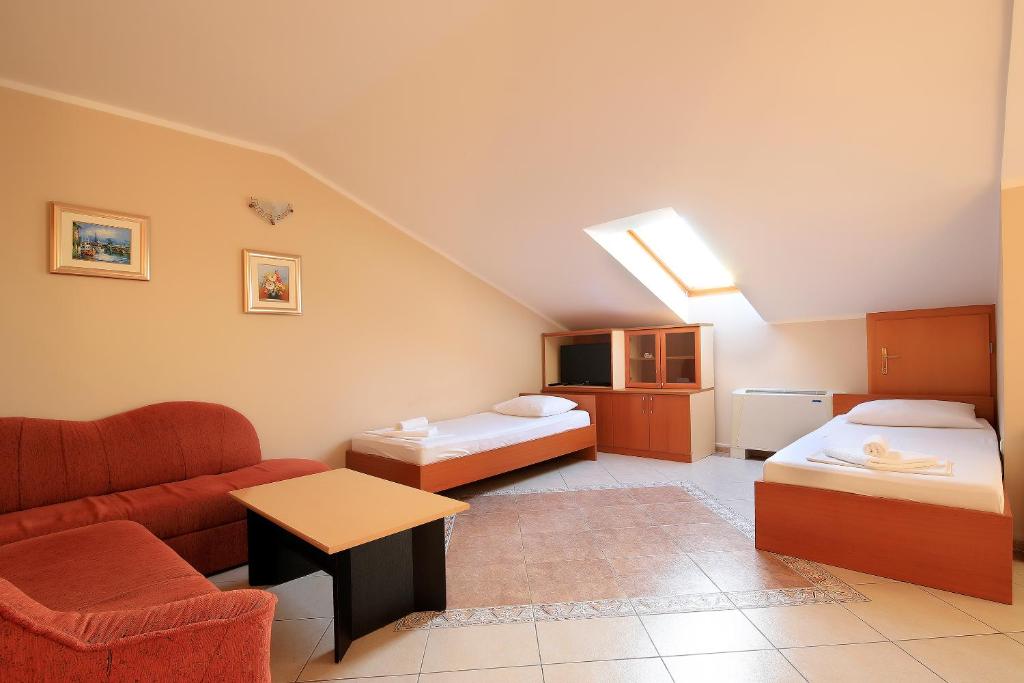 Postel nebo postele na pokoji v ubytování Resort Trcol
