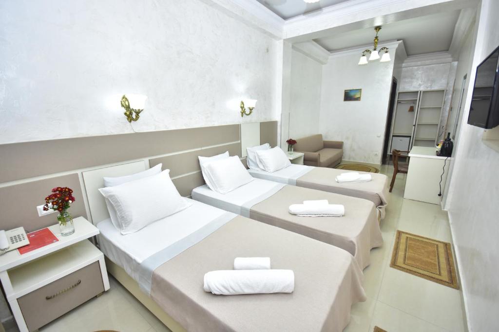Postel nebo postele na pokoji v ubytování Hotel Chao