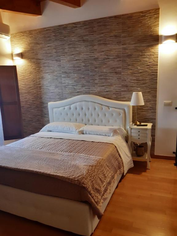 Postel nebo postele na pokoji v ubytování La casetta nel claustro