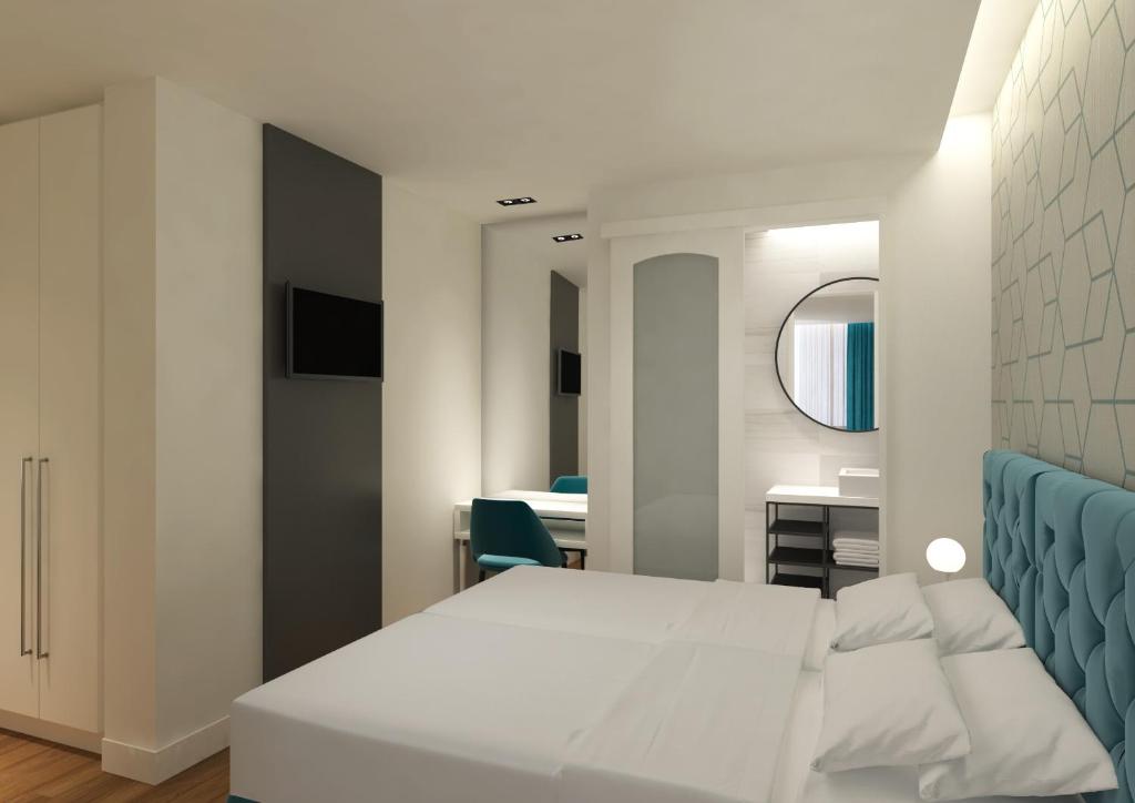Postel nebo postele na pokoji v ubytování Athenian Montaza Hotel
