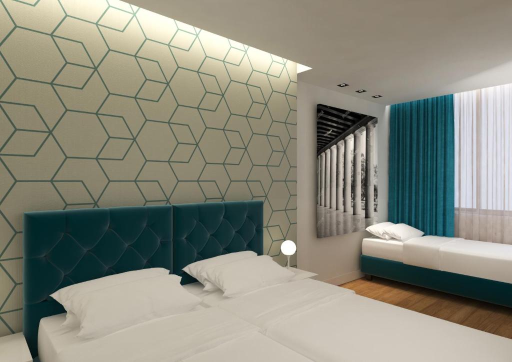 Postel nebo postele na pokoji v ubytování Athenian Montaza Hotel