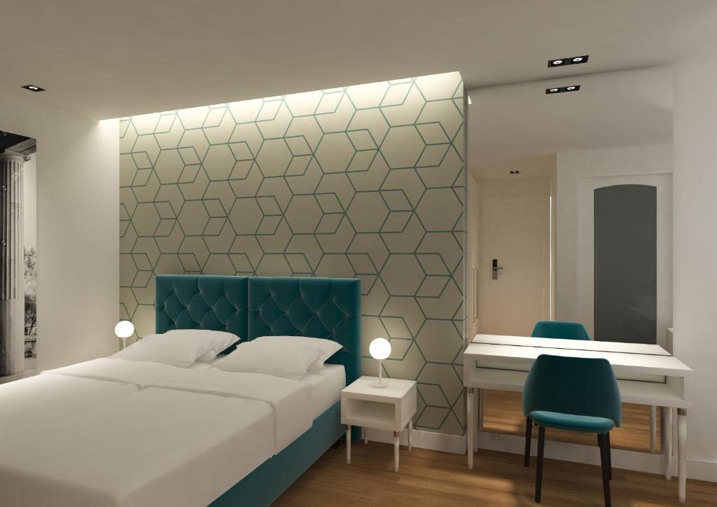Postel nebo postele na pokoji v ubytování Athenian Montaza Hotel