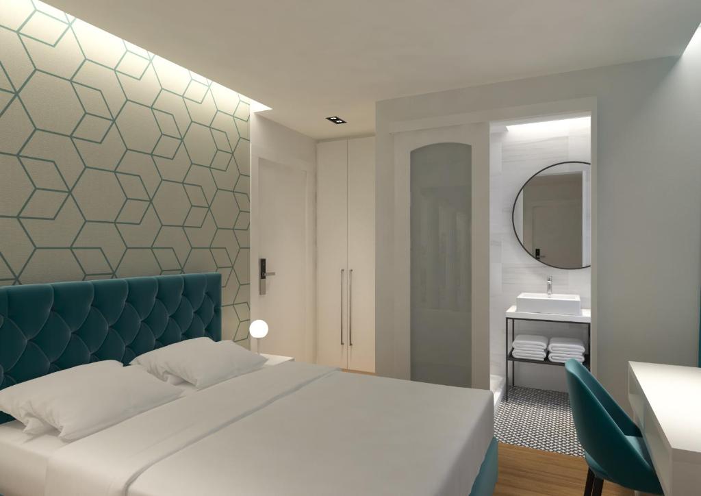 Postel nebo postele na pokoji v ubytování Athenian Montaza Hotel