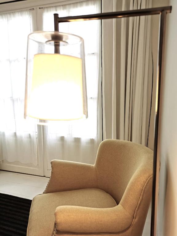 Posezení v ubytování Le Clos Saint-Martin Hôtel & Spa
