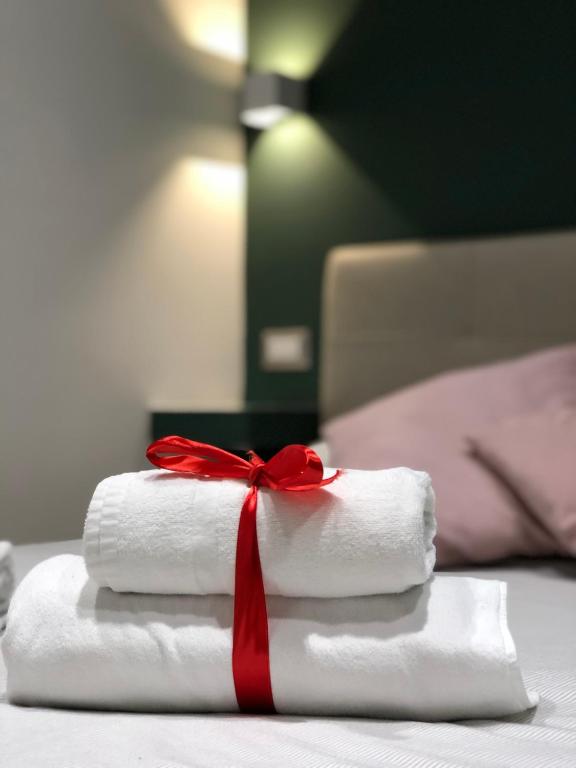 Postel nebo postele na pokoji v ubytování NSH AppartHotel, Napoli Centro
