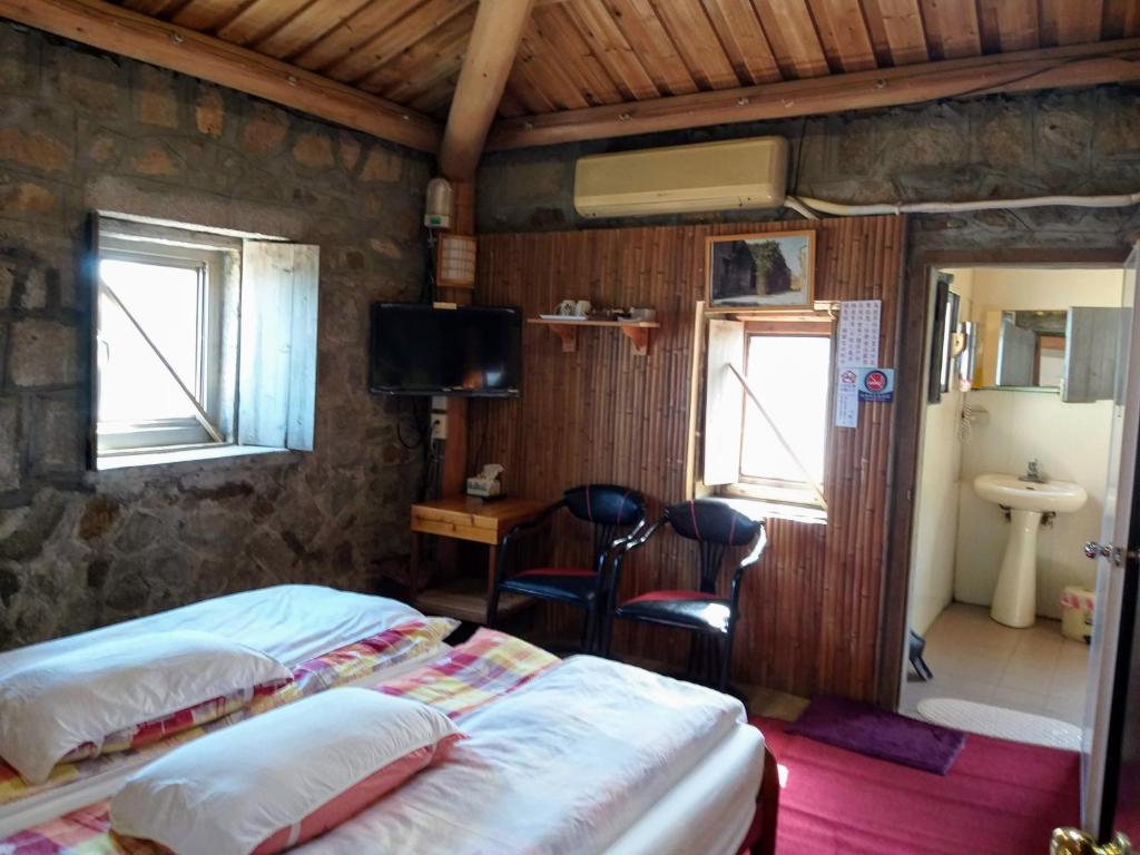 Postel nebo postele na pokoji v ubytování Chin -Be Village Cafe & Homestay
