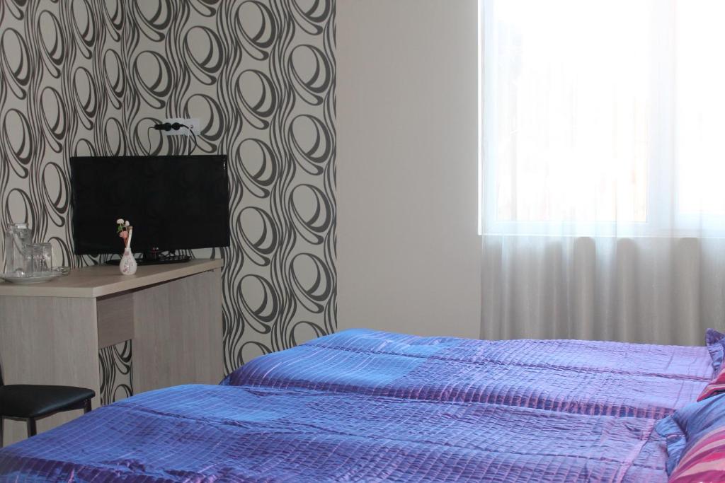 Postel nebo postele na pokoji v ubytování Hotel Elio
