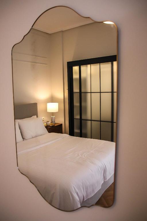 Posteľ alebo postele v izbe v ubytovaní API Projects Athens - Cartier Apartment