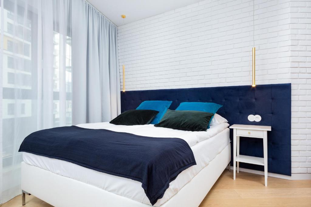 Posteľ alebo postele v izbe v ubytovaní Apartments Warsaw CityLink by Noclegi Renters