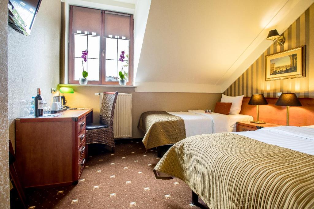 Postel nebo postele na pokoji v ubytování Hotel Diament Bella Notte Katowice - Chorzów