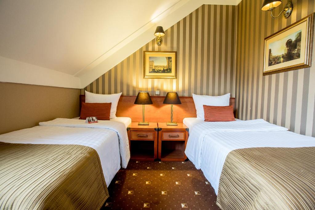 Postel nebo postele na pokoji v ubytování Hotel Diament Bella Notte Katowice - Chorzów