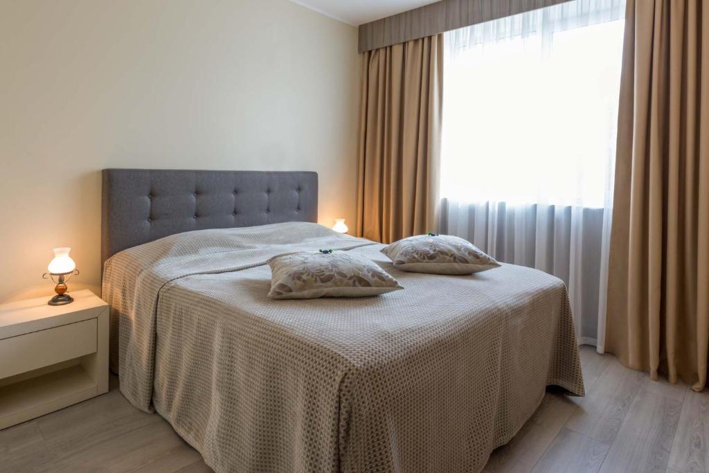 Letto o letti in una camera di Viiking Spa Hotel
