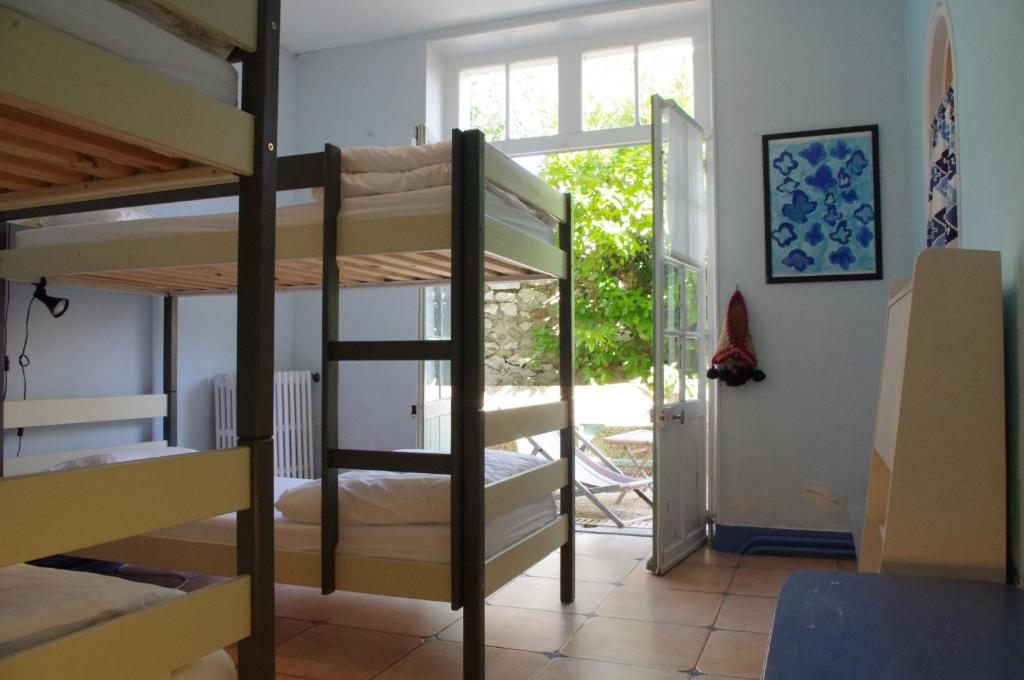 Postel nebo postele na pokoji v ubytování Cassis Hostel