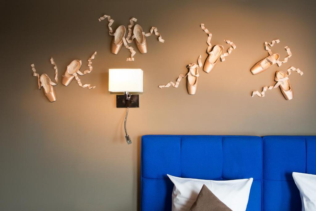 Postel nebo postele na pokoji v ubytování Hotel The Neufchatel