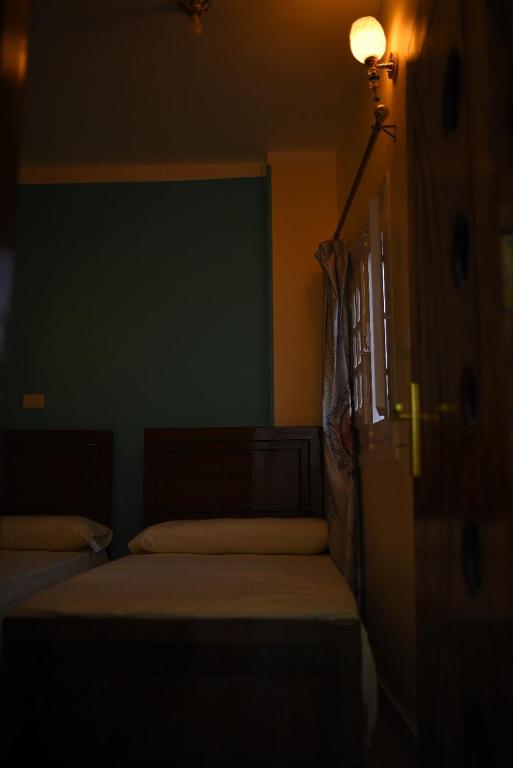 Postel nebo postele na pokoji v ubytování Kosh royal house