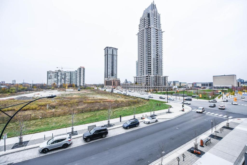 a highway with cars driving on it in a city at PlanURstay- Mississauga Downtown Square One Shopping Centre in Mississauga