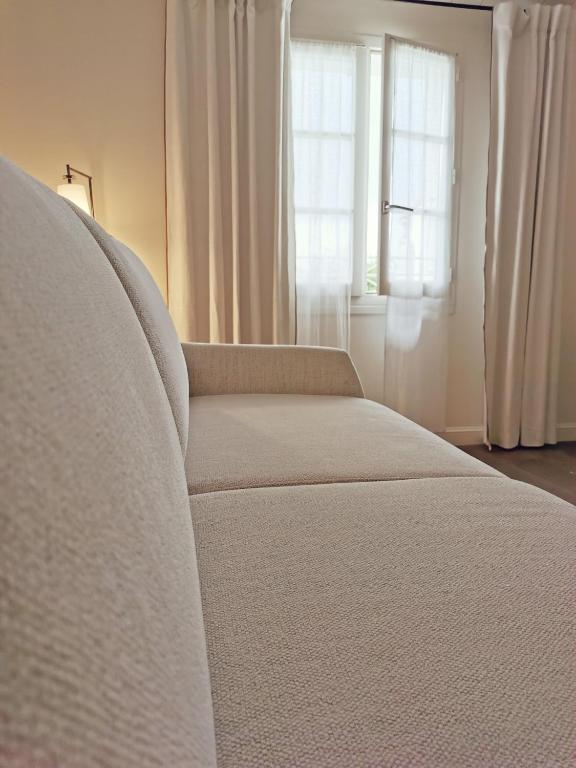 Postel nebo postele na pokoji v ubytování Le Clos Saint-Martin Hôtel & Spa