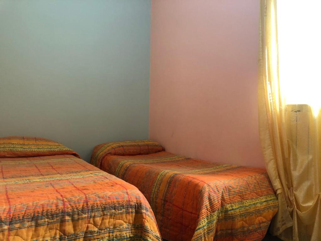 Postel nebo postele na pokoji v ubytování B&B Al Castello
