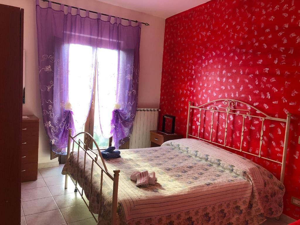 Postel nebo postele na pokoji v ubytování B&B Al Castello