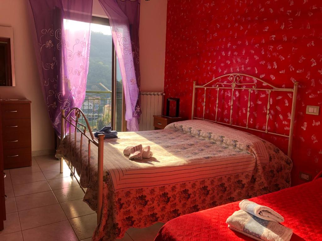 Postel nebo postele na pokoji v ubytování B&B Al Castello