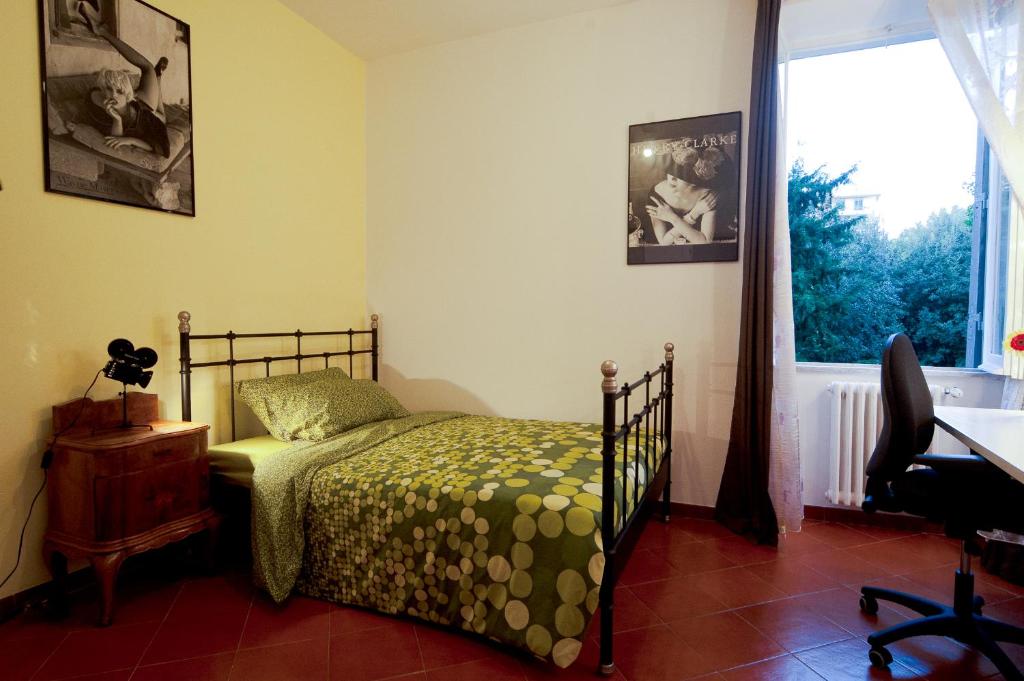 Postel nebo postele na pokoji v ubytování Light of Rome