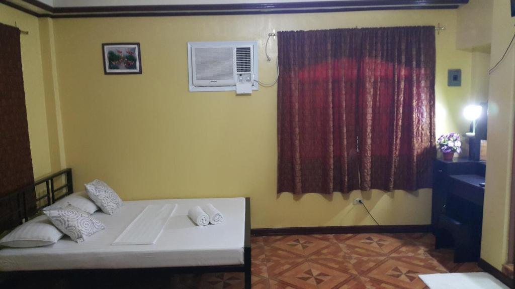 Postel nebo postele na pokoji v ubytování Carribean Transient House