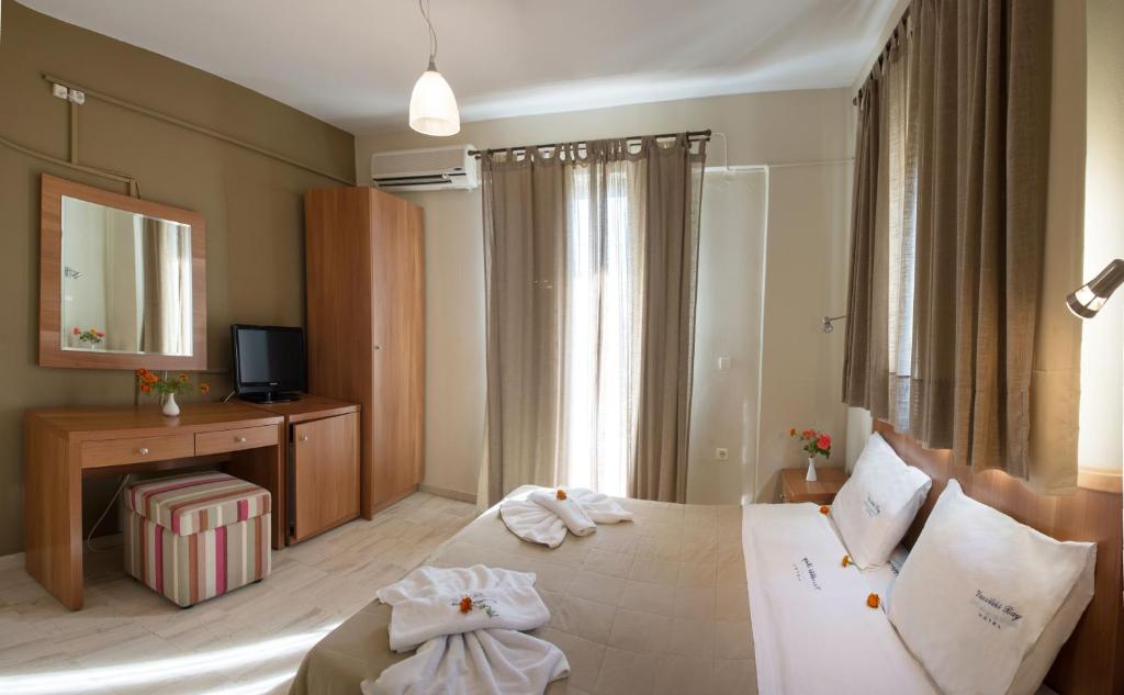 Postel nebo postele na pokoji v ubytování Vassiliki Bay Hotel