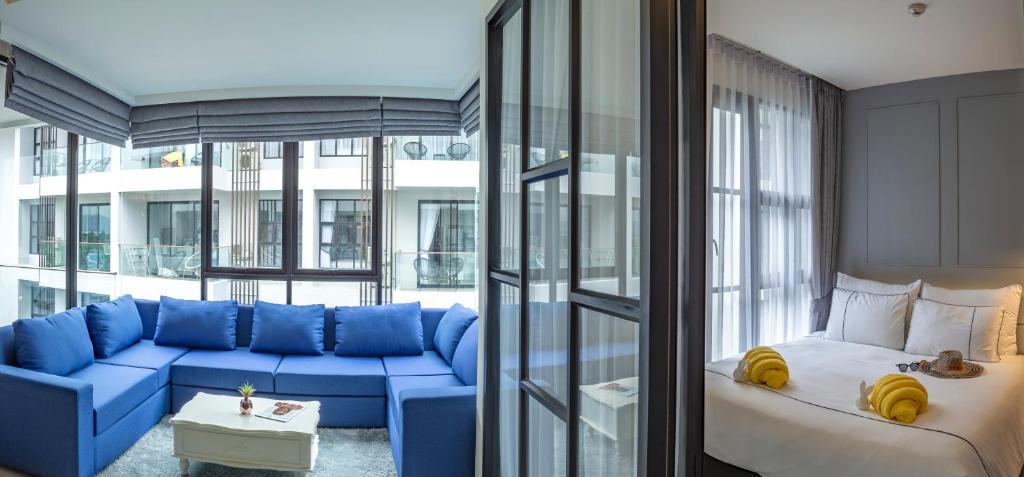 Postel nebo postele na pokoji v ubytování Surin Beach Residence - Official Account