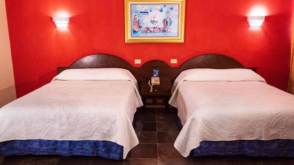 Postel nebo postele na pokoji v ubytování Hotel Tapachula