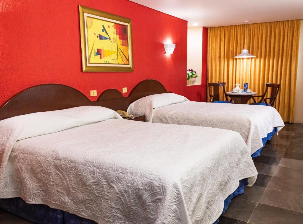 Postel nebo postele na pokoji v ubytování Hotel Tapachula