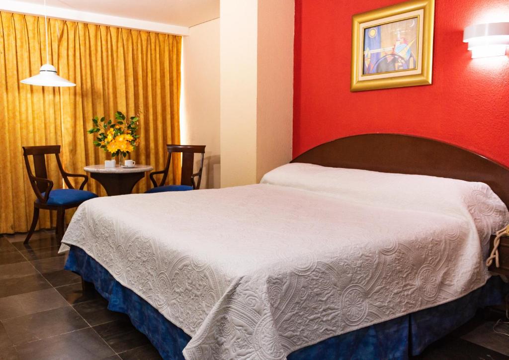 Postel nebo postele na pokoji v ubytování Hotel Tapachula