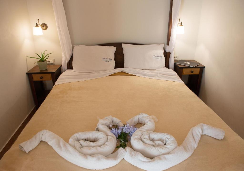 Postel nebo postele na pokoji v ubytování Vassiliki Bay Hotel
