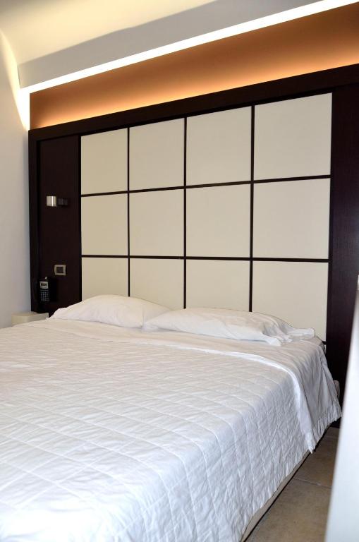 Postel nebo postele na pokoji v ubytování Hotel Testani Frosinone
