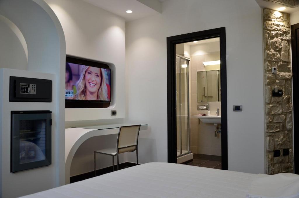 Postel nebo postele na pokoji v ubytování Hotel Testani Frosinone