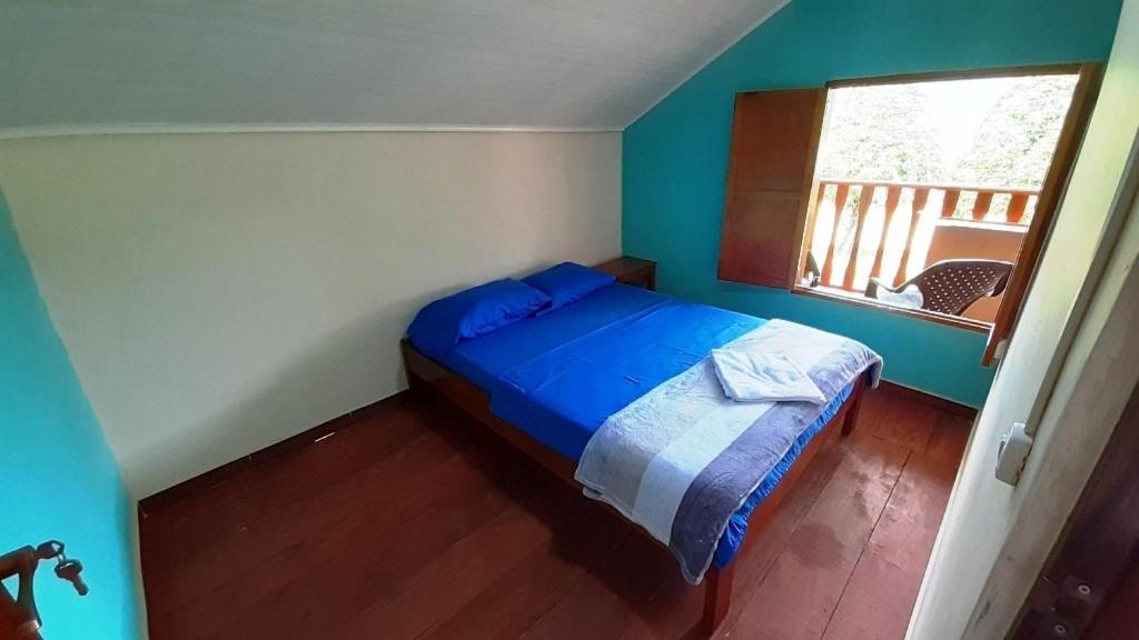 Postel nebo postele na pokoji v ubytování Los Balcones Hostal - Caliyaco