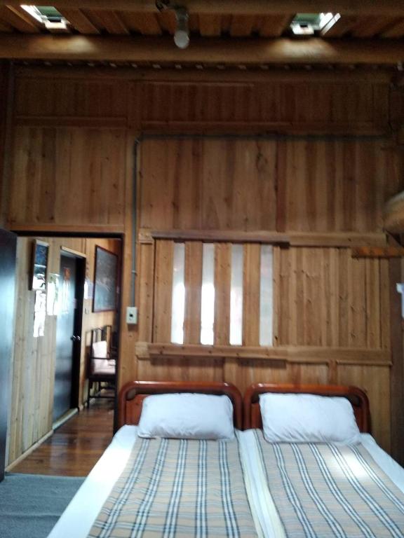 Postel nebo postele na pokoji v ubytování Chin -Be Village Cafe & Homestay