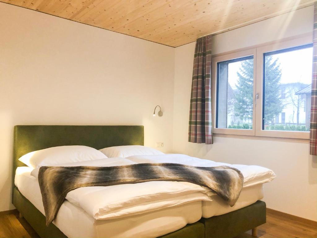 Postel nebo postele na pokoji v ubytování Woodpecker Chalets
