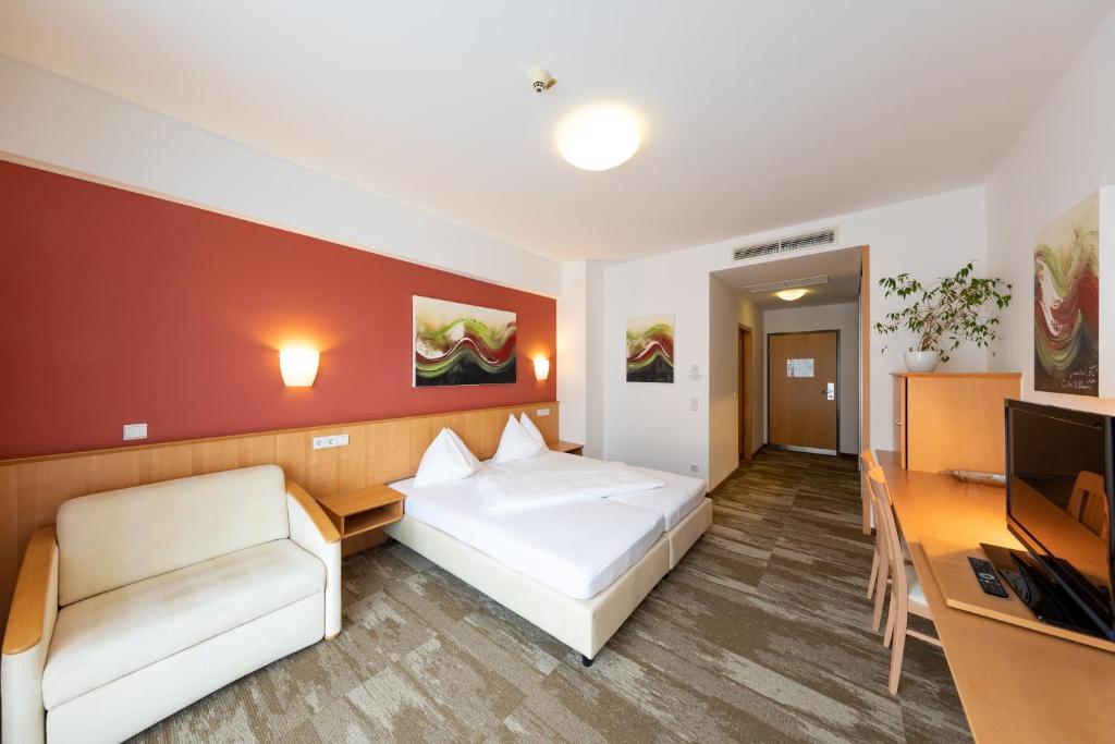 Televízia a/alebo spoločenská miestnosť v ubytovaní Hotel Bokan Exclusiv