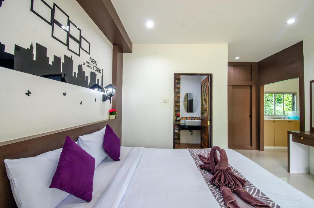 Postel nebo postele na pokoji v ubytování Khum Maikaew Resort