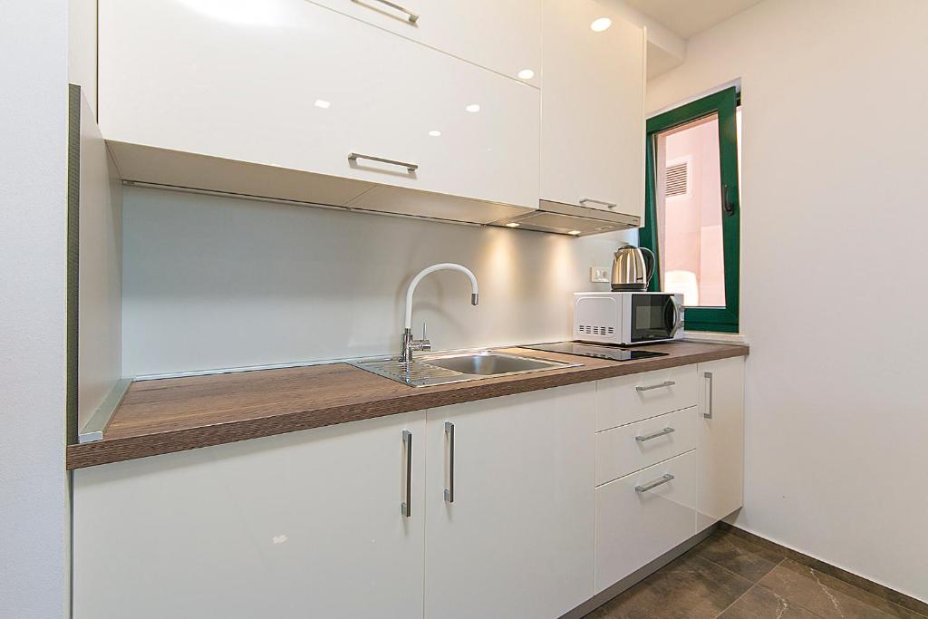 Kuchyňa alebo kuchynka v ubytovaní Apartment Roso