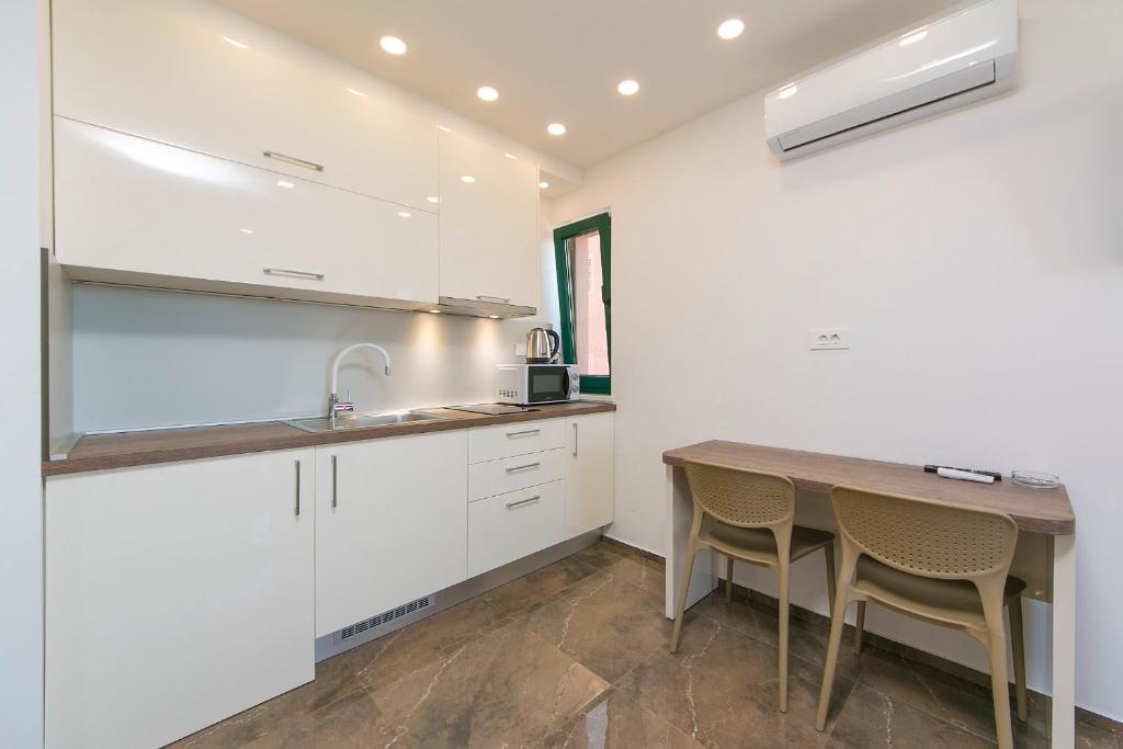 Kuchyňa alebo kuchynka v ubytovaní Apartment Roso