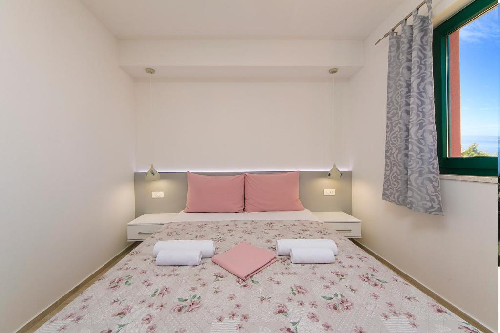 Posteľ alebo postele v izbe v ubytovaní Apartment Roso