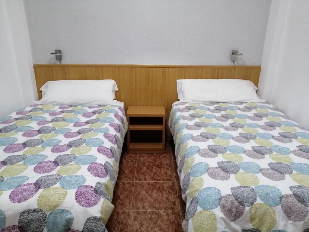 Postel nebo postele na pokoji v ubytování Hostal Andrés