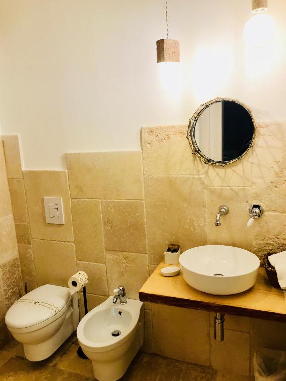 Baðherbergi á Relais Trulli Le Icone