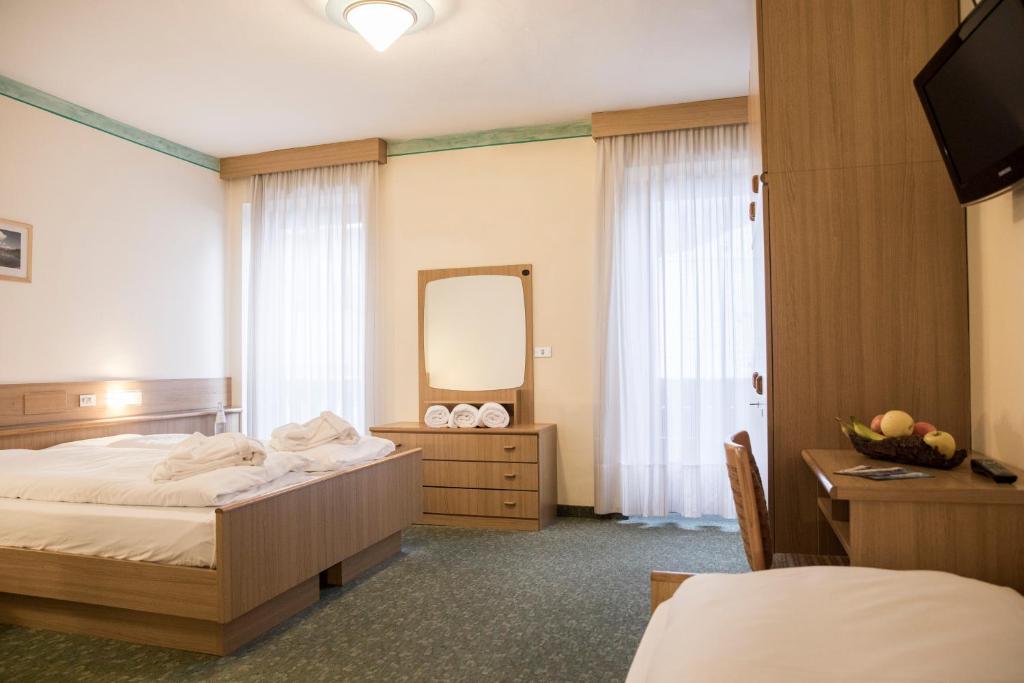 Postel nebo postele na pokoji v ubytování Active Hotel Rosat