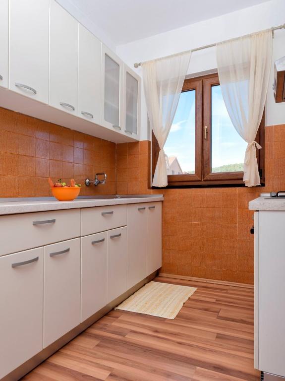 Kuchyňa alebo kuchynka v ubytovaní Apartments Draganic